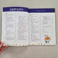 Open book with a table of contents on a textured surface