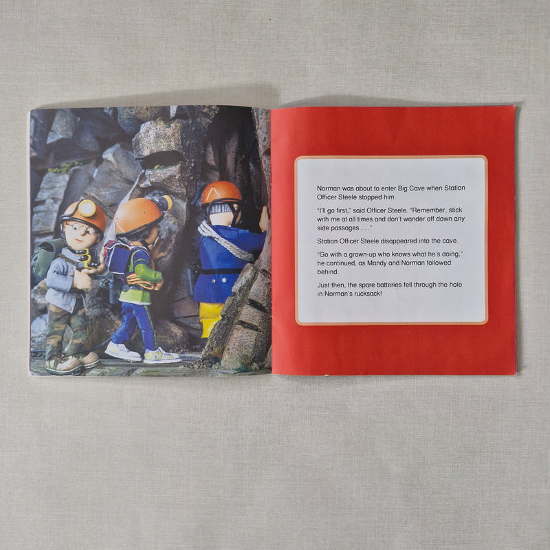 Open book with illustration of climbers and text on a red background