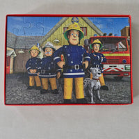 Children's puzzle with a fireman and dog character on a box