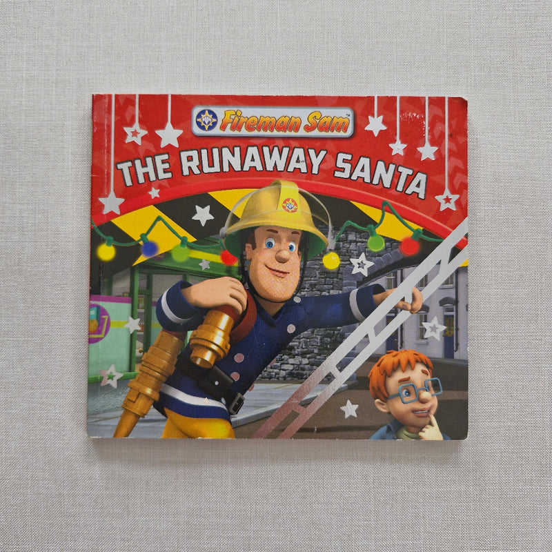 Children's book titled 'The Runaway Santa' featuring a firefighter character on a grey background