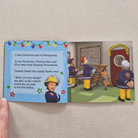 Children's book with illustrations of firefighters and Christmas decorations on a beige background