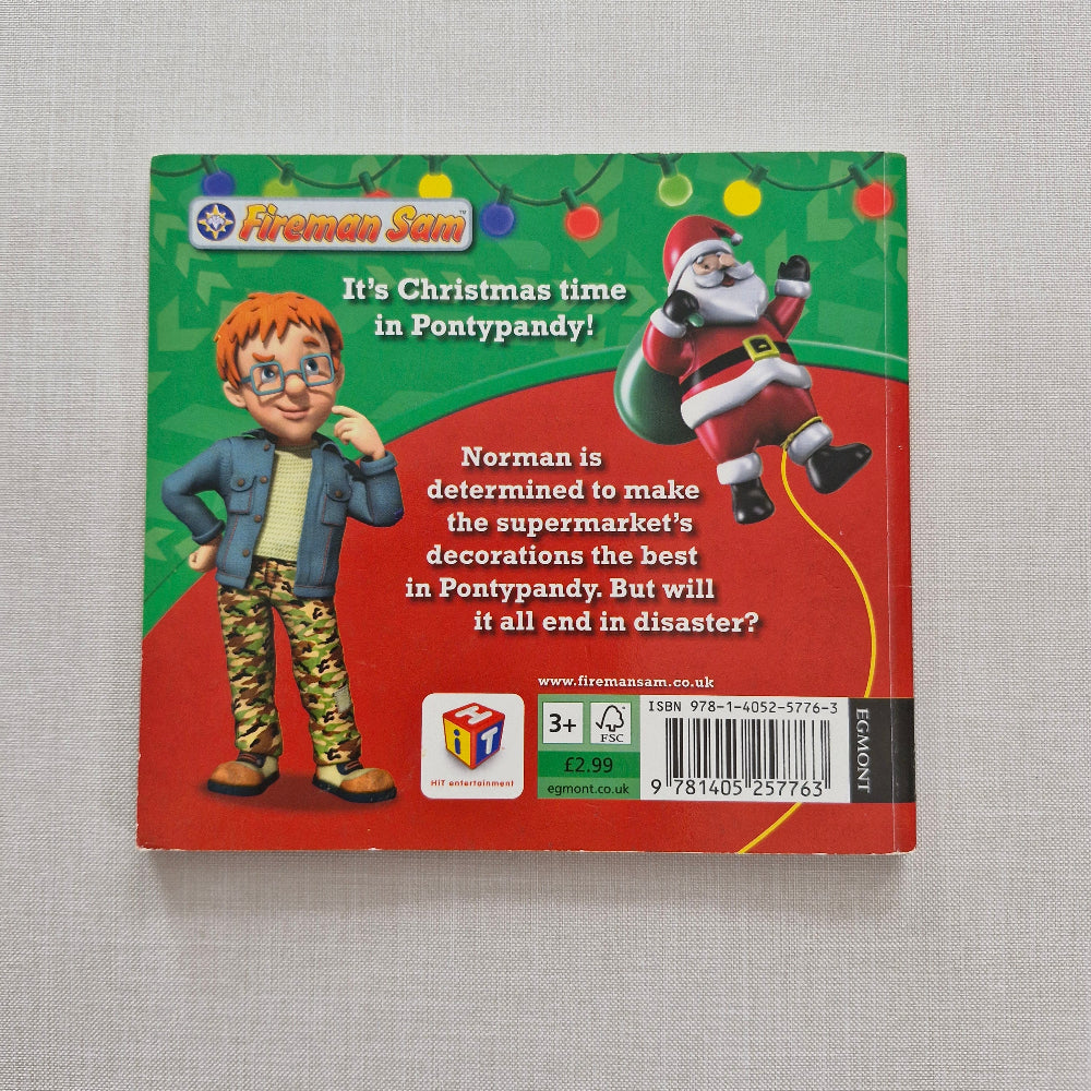 Book back cover with Christmas-themed illustrations and text on a grey background