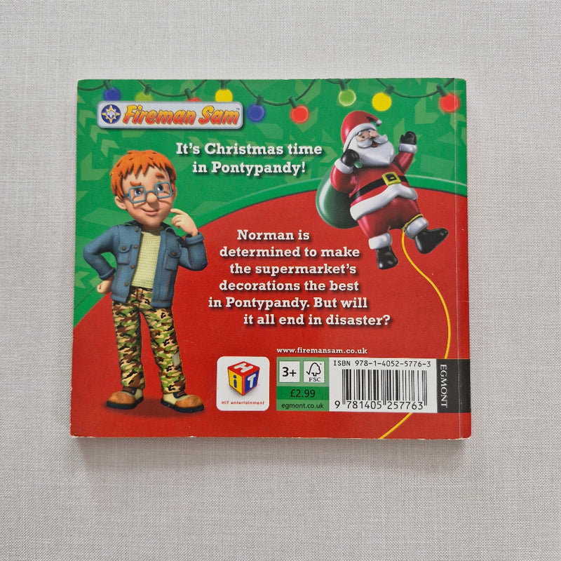 Book back cover with Christmas-themed illustrations and text on a grey background