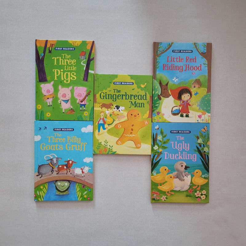 Set of children's books with colourful covers on a gray background