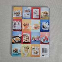 Book cover with colorful square grid of food images on a gray background