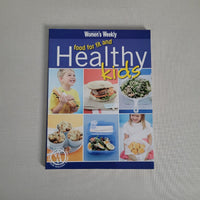 Book titled 'Healthy Kids' by Women's Weekly on a gray background