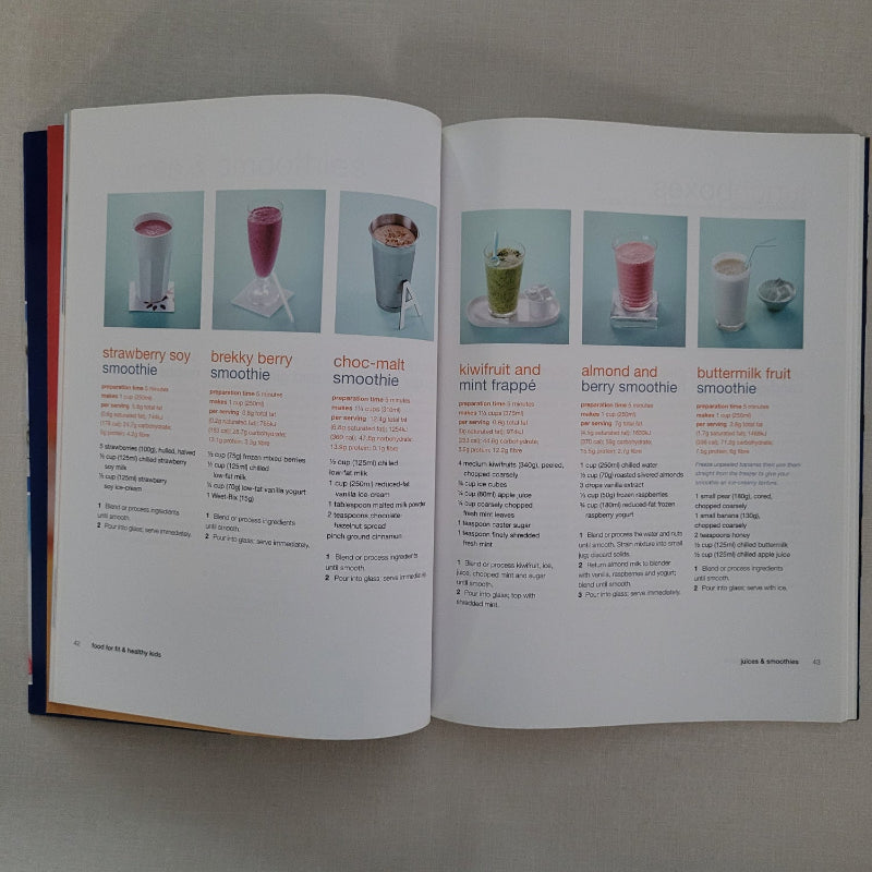 Open book with recipe illustrations and text on a gray background