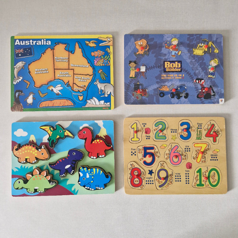 Four children's educational puzzles on a light gray background