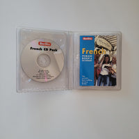 Open plastic case showing a CD and Phrase book for the French language