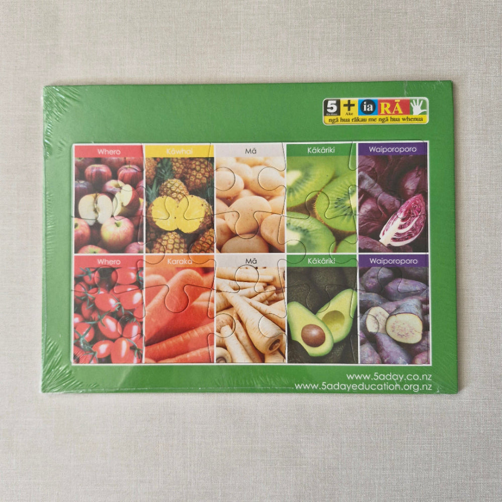 Packaged puzzle with colorful images of fruits and vegetables on a green background