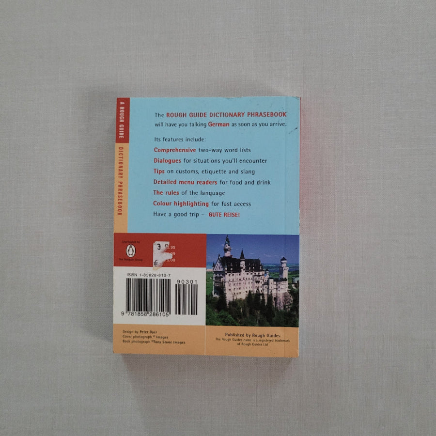 Back cover of a book with a cityscape illustration on a gray surface