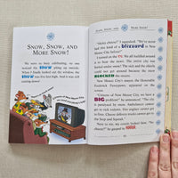 Open book with cartoon illustration on a textured surface