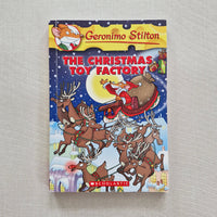Book titled 'The Christmas Toy Factory' by Geronimo Stilton on a textured surface