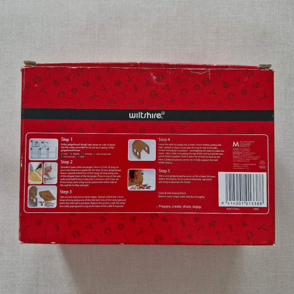 Back of box, Wiltshire Ginergerbread House Kit on a grey background