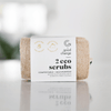 Packaged eco scrub with 'Good Change' label on a reflective surface