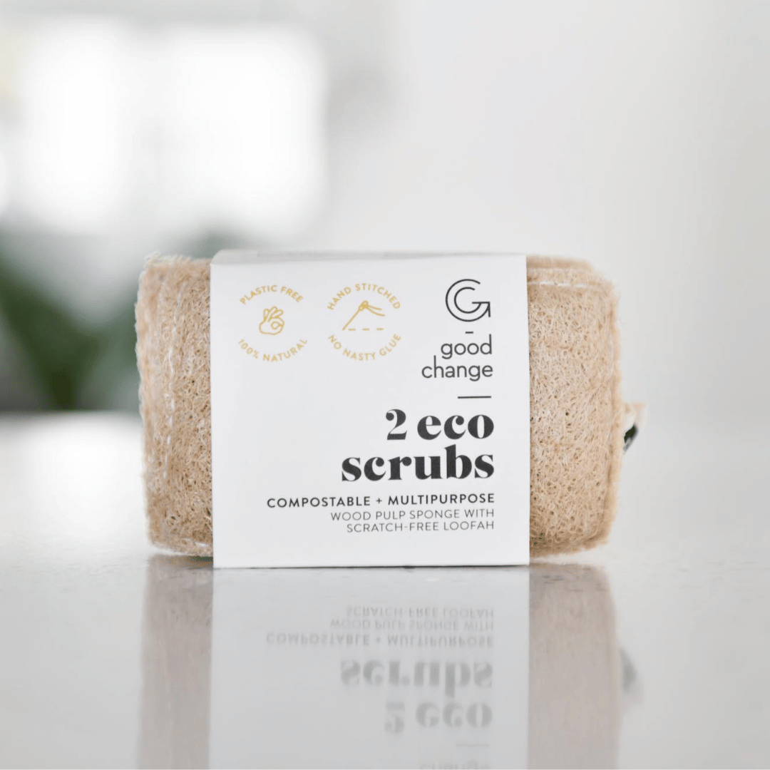 Packaged eco scrub with 'Good Change' label on a reflective surface