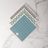 3 Pack of Good Change Eco Cloths, each with a different geometric pattern on a marble surface