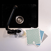 Black kitchen sink with a faucet and 3 pack of eco cloths on a white kitchen bench top