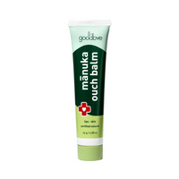 Manuka Ouch Balm tube with green and white design on a white background