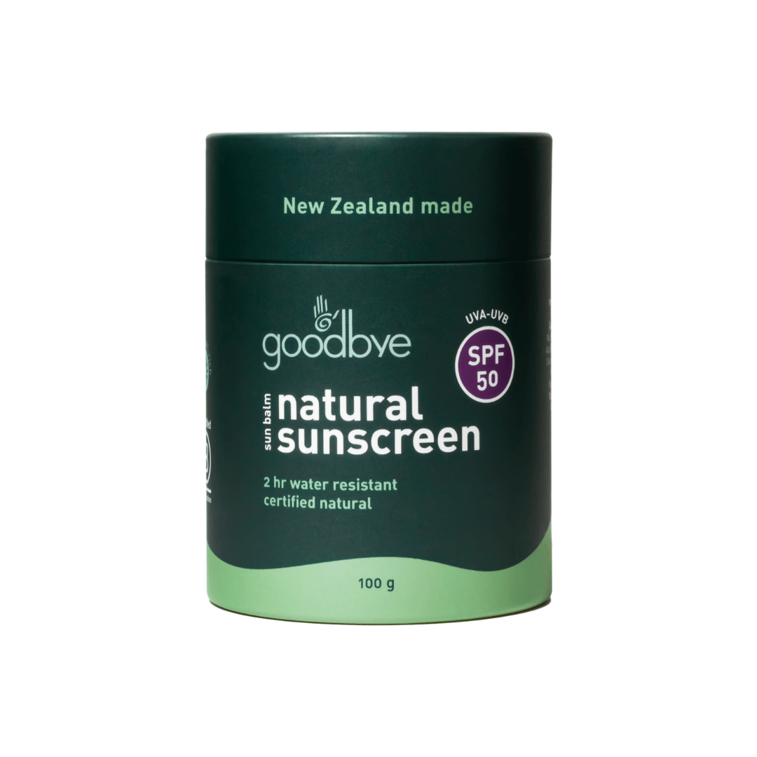 Goodbye natural sunscreen container with green lid and base on a white background