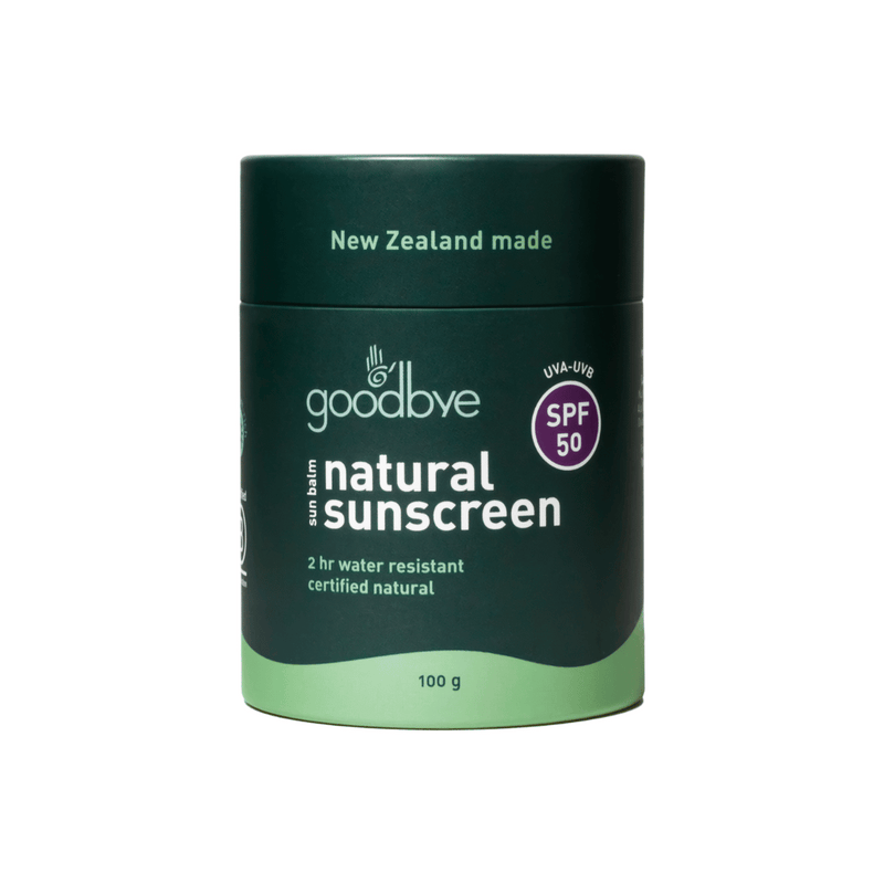 Goodbye natural sunscreen container with green lid and base on a white background