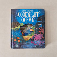 Children's book titled 'Goodnight Ocean' on a beige surface