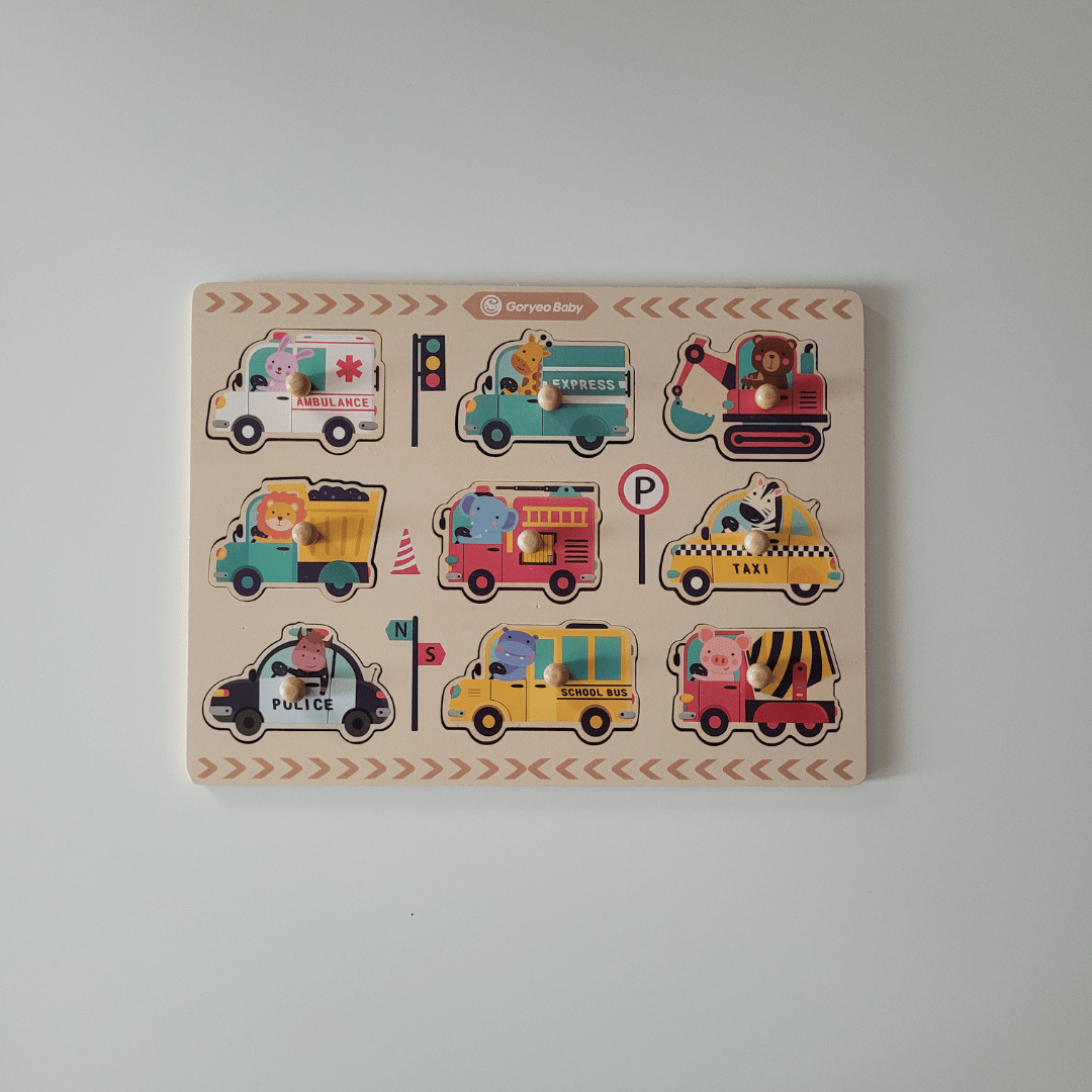 Wooden puzzle with colorful vehicle illustrations on a plain background
