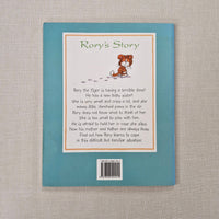 Back cover of a book titled 'Rory's Story' with text on a textured surface.