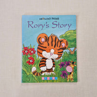 Children's book titled 'Rory's Story' with a tiger character on the cover, placed on a textured surface.
