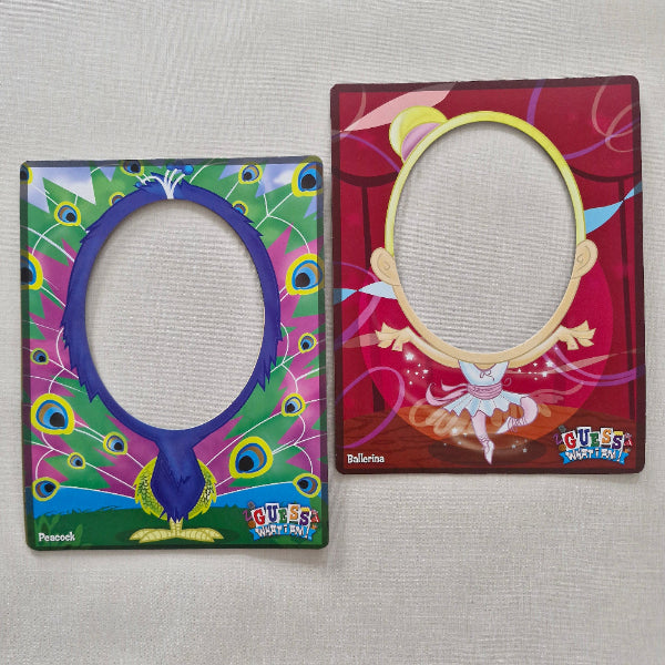 Two colourful card holders with circular cutouts on a gray surface