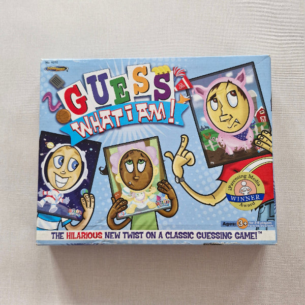Board game box with cartoon characters and text on a beige background