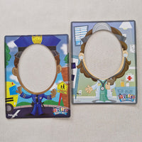 Two children's activity mats with illustrated scenes on a light gray background