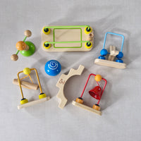 Colourful wooden toys on a light grey background