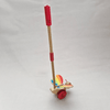 Toy with a red handle and colorful base on a white background