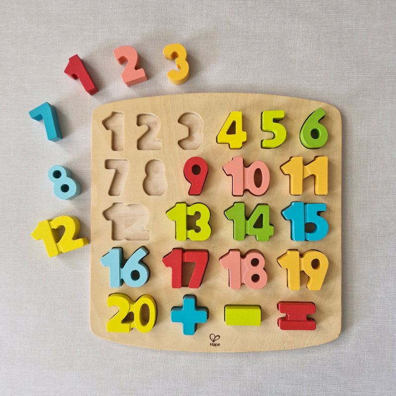 Wooden puzzle with colourful numbers on a light grey background