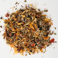 A spoonful of dried herbal mix from the product 'Hemp Relief' is shown on a white background