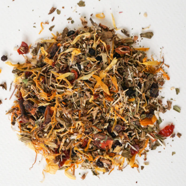 A spoonful of dried herbal mix from the product 'Hemp Relief' is shown on a white background