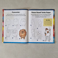 Open book showing pages with illustrations of dogs and text on a textured surface