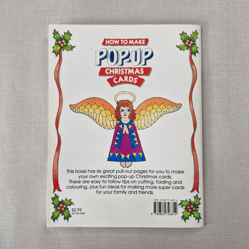 Book back cover for 'How to Make Pop-Up Christmas Cards' with an angel illustration on a grey background