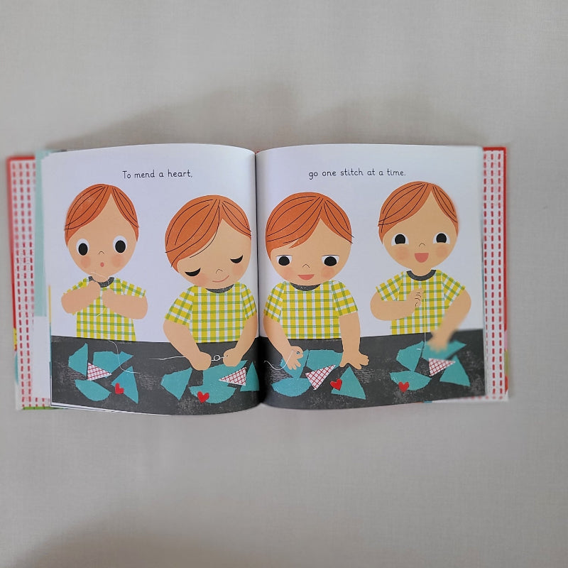 Open book page with 4 children sewing pieces of material together