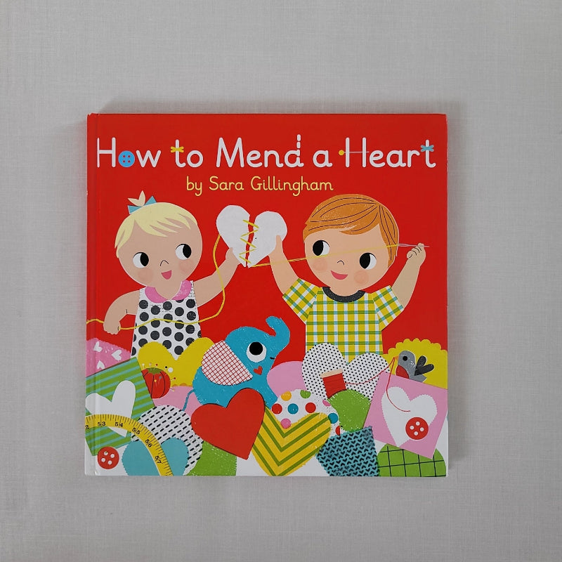 How to Mend a Heart book with 2 children on front cover holding a broken material heart between them