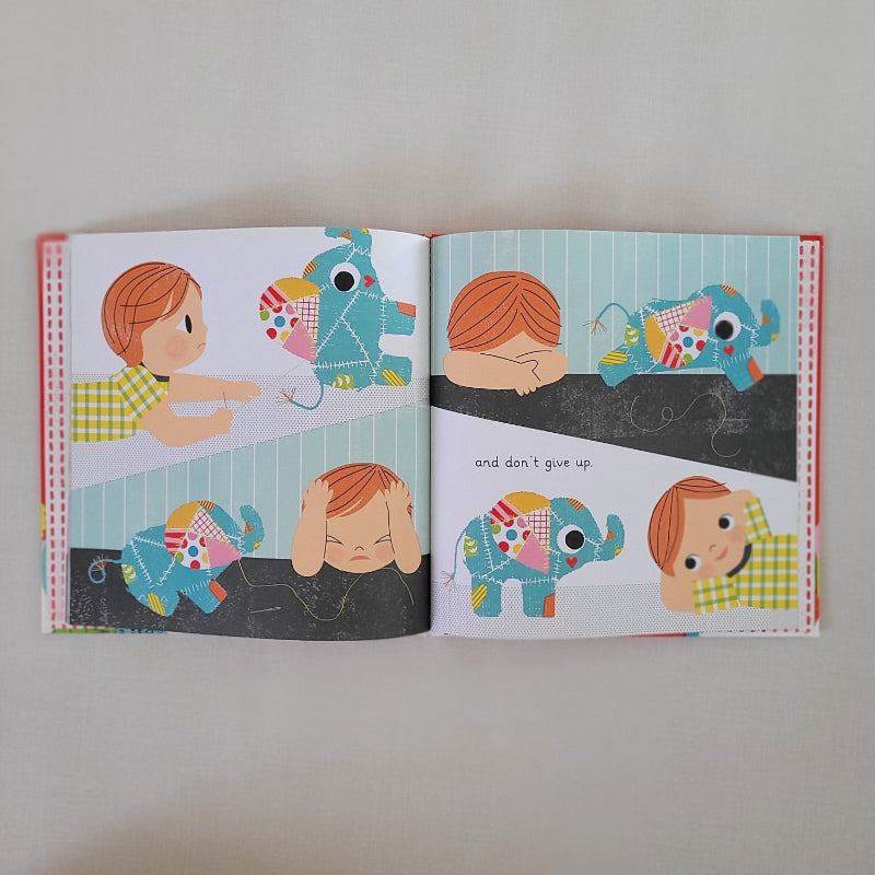Open page with 4 children showing frustration on their faces as attempted to sew a patch on an elephant