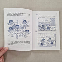 Open book with illustrations of jumping children and text on a textured surface
