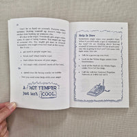 Open book with text and a diagram on a textured surface