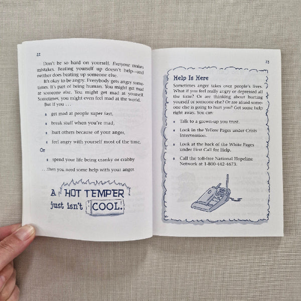 Open book with text and a diagram on a textured surface