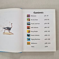 Open book showing a table of contents with illustrations on a textured surface