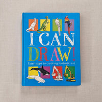 Book titled 'I Can Draw!' with colourful illustrations on a beige background