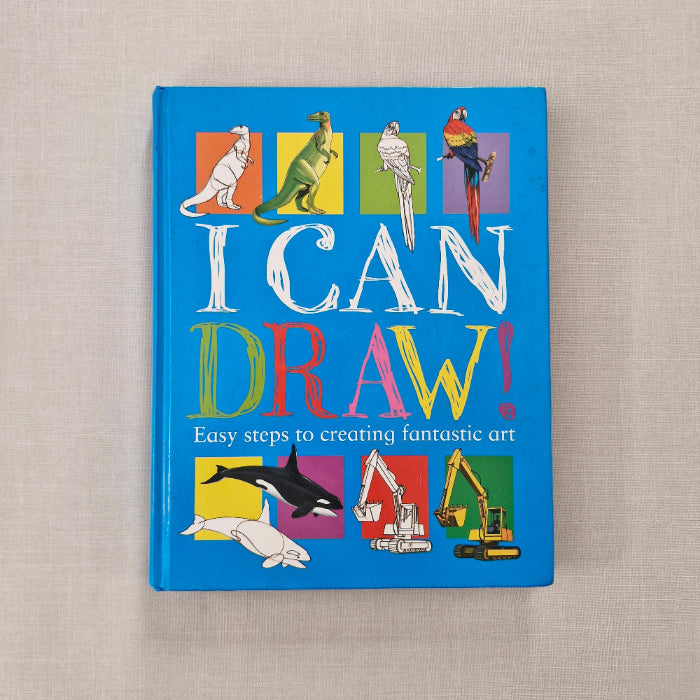 Book titled 'I Can Draw!' with colourful illustrations on a beige background