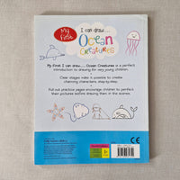 Back cover of a children's book titled 'I can draw Ocean Creatures' on a textured surface.