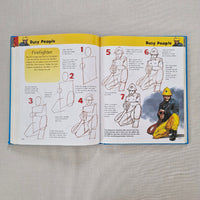 Open book showing illustrations of a firefighter and text on a gray background